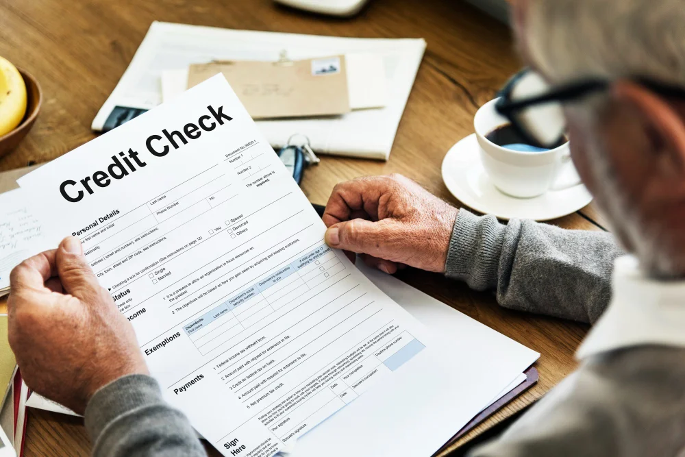 Man looking at credit check document